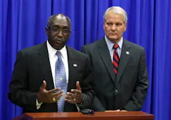 Sanford Police Chief Cecil Smith, left, addresses the media as Seminole County Sheriff Donald Eslinger, right, listens on July 4. Sanford Police Chief Cecil Smith, left, addresses the media as Seminole County Sheriff Donald Eslinger, right, listens on July 4.