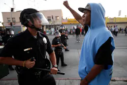 A protester confronts a Los Angles police officer during a demonstration in reaction to the acquittal of neighborhood watch volunteer George Zimmerman on July 15. A protester confronts a Los Angles police officer during a demonstration in reaction to the acquittal of neighborhood watch volunteer George Zimmerman on July 15.