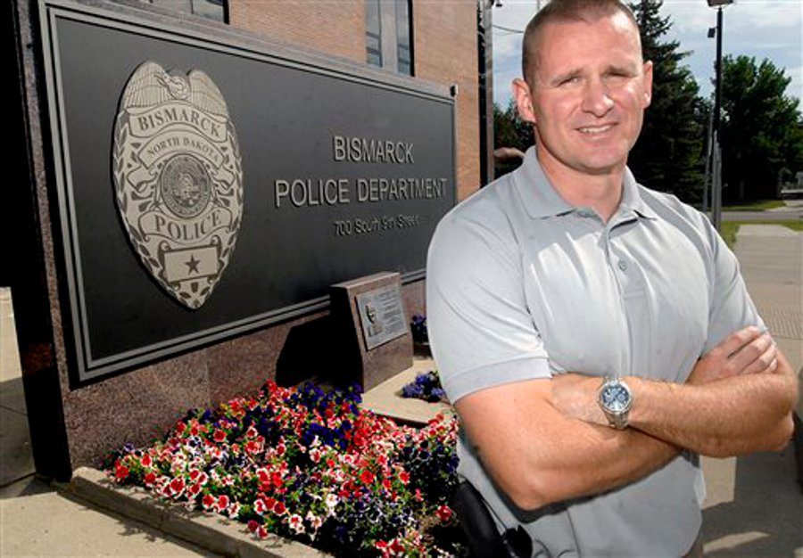 Bismarck Police Officer Kent Kaylor poses outside the Bismarck Police Department on Aug. 28.