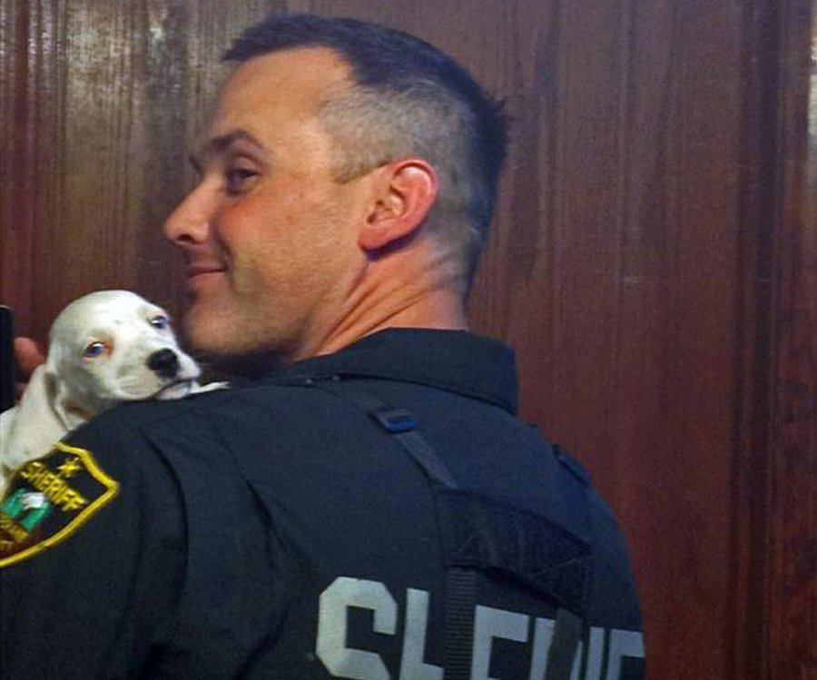 Spokane County Deputy Marc Melville said he couldn't resist the puppy's charms and took him home.