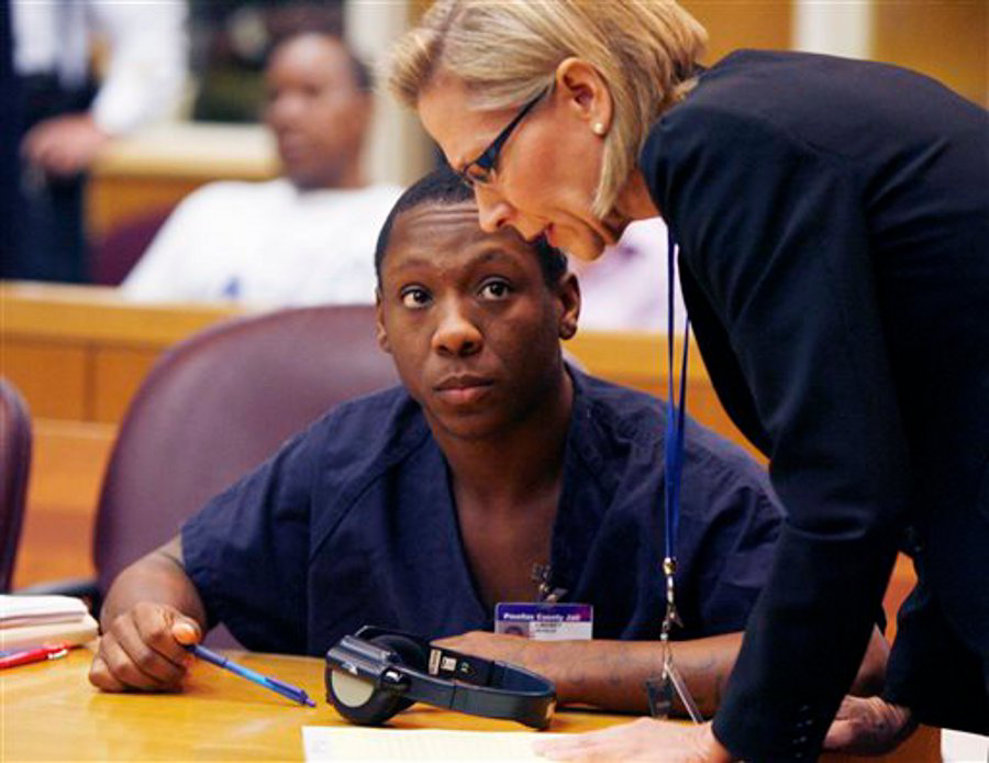 Nicholas Lindsey, left, looks at his attorney Stacey Schroeder, right, during his resentencing hearing at the Pinellas County Justice Center in Largo, Fla. on Sept. 23.