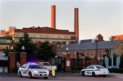 Police cars line the gate in the early morning as essential personnel only are allowed into a closed Washington Navy Yard in Washington on Sept. 17. Police cars line the gate in the early morning as essential personnel only are allowed into a closed Washington Navy Yard in Washington on Sept. 17.