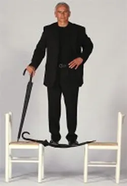 Unbreakable Umbrella inventor Thomas Kurz stands on one of his inventions suspended between two chairs. The umbrella worked perfectly afterwards. Unbreakable Umbrella inventor Thomas Kurz stands on one of his inventions suspended between two chairs. The umbrella worked perfectly afterwards.