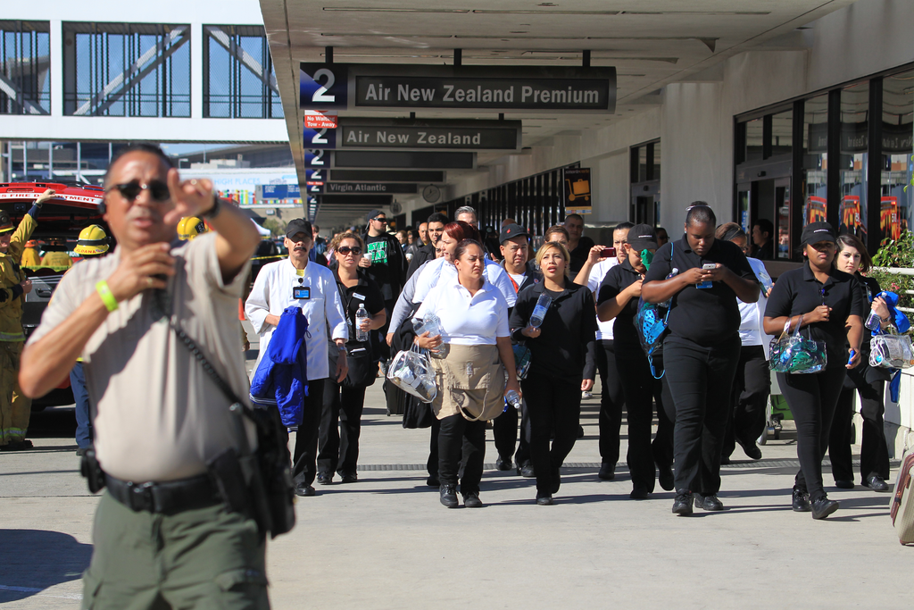 Passengers are directed outside Terminal 2 at Los Angeles International Airport on Nov. 1 after shots were fired.