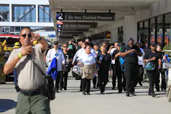 Passengers are directed outside Terminal 2 at Los Angeles International Airport on Nov. 1 after shots were fired. Passengers are directed outside Terminal 2 at Los Angeles International Airport on Nov. 1 after shots were fired.