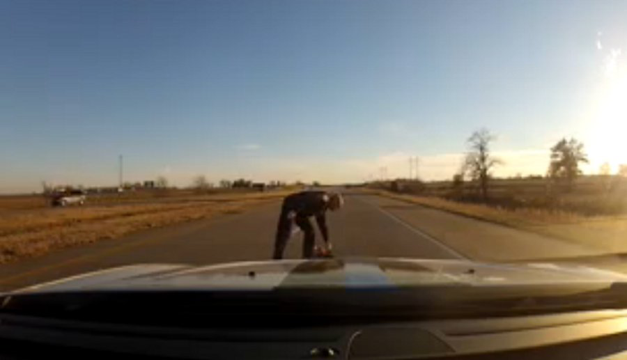 Dashcam video shows Evansville Sgt. Jason Cullum traveling on I-164 when he stopped his cruiser to retrieve a young girl's teddy bear from the road.