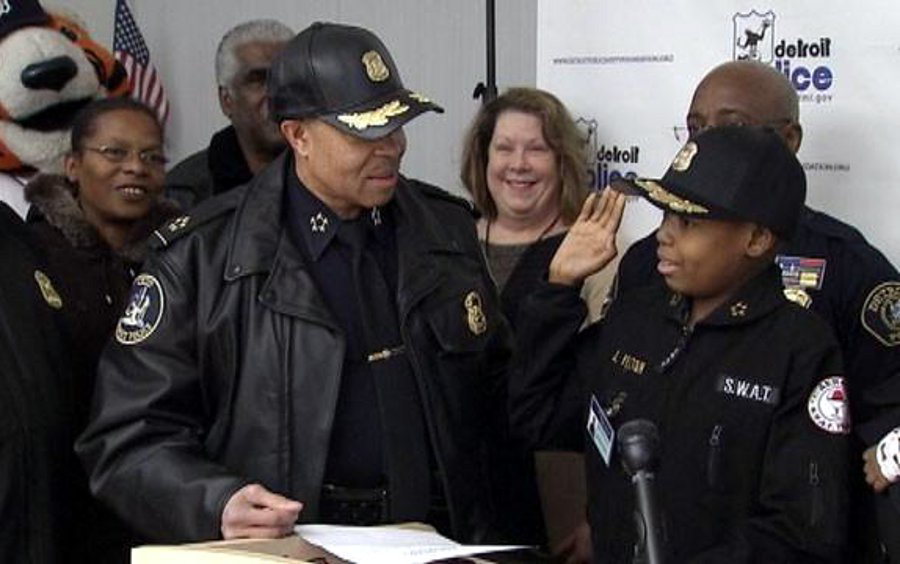 Jayvon Felton, a 9-year-old with acute lymphoblastic leukemia, is seen next to Detroit Police Chief James Craig on Jan. 31 at Public Safety Headquarters.