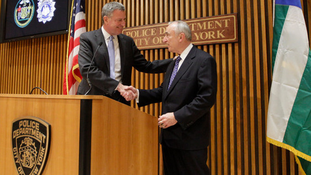 New York City Mayor Bill de Blasio, left, greets incoming NYPD Commissioner William J. Bratton during a joint news conference at police headquarters on Jan. 2.