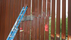 A repair crew's ladder leans against a section of the border fence under repair near Nogales, Ariz. on July 27. A repair crew's ladder leans against a section of the border fence under repair near Nogales, Ariz. on July 27.