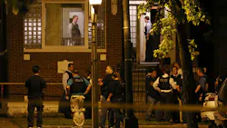 Chicago officers and detectives gather at the home where 11-year-old Shamiya Adams was shot Friday night. Chicago officers and detectives gather at the home where 11-year-old Shamiya Adams was shot Friday night.