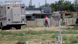 Albuquerque police work at the scene where two men were found dead in a open area just north of Central Avenue at 60th Street on July 19. Albuquerque police work at the scene where two men were found dead in a open area just north of Central Avenue at 60th Street on July 19.