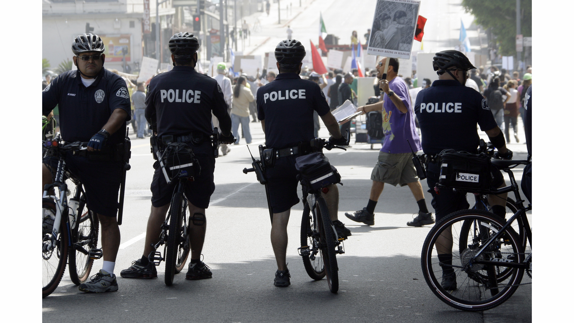 Officers on bicycles keep watch as demonstrators protesting several incidents of alleged Los Angeles Police Department brutality.
