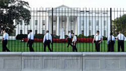 Uniformed Secret Service officers walk along the fence on the North side of the White House in Washington on Sept. 20. Uniformed Secret Service officers walk along the fence on the North side of the White House in Washington on Sept. 20.