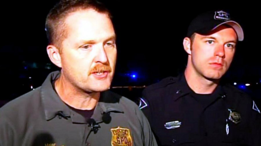 Interim Police Chief Mike Gambrell talks to reporters about a shooting at the Greenville County Law Enforcement Center that left a police officer was seriously wounded and a suspect was dead.