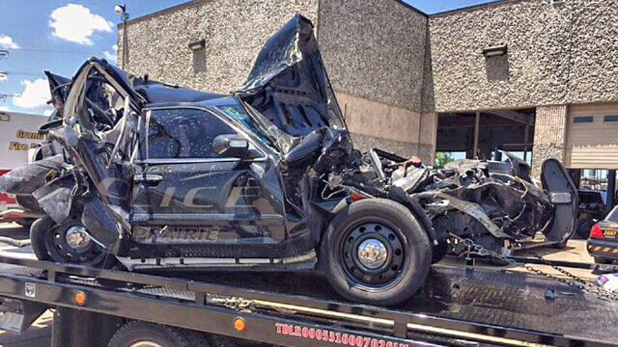 A police officer was struck by his own cruiser during a traffic stop on Interstate 30 when an SUV rear-ended the vehicle while he was standing outside on June 18.