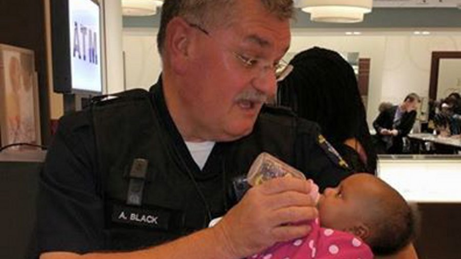 Overland Park Police Officer Andy Black was helping a mother at a mall who had just had a seizure.
