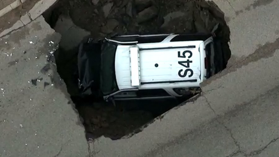 Sheridan Police Sgt. Grege Miller was on patrol early Friday morning when the road gave way, causing his SUV to fall in.