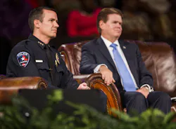 Arlington police chief Will Johnson, left, and Arlington mayor Jeff Williams listen to proceedings at a 'Unity, Peace and Prayer Rally' at Cornerstone Baptist Church in Arlington, Texas on Aug. 12 for Christian Taylor. Arlington police chief Will Johnson, left, and Arlington mayor Jeff Williams listen to proceedings at a 'Unity, Peace and Prayer Rally' at Cornerstone Baptist Church in Arlington, Texas on Aug. 12 for Christian Taylor.