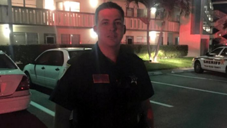 Palm Beach County Sheriff's Deputy Brandon Serraes carried the couple down two flights of stairs Saturday night.
