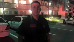 Palm Beach County Sheriff's Deputy Brandon Serraes carried the couple down two flights of stairs Saturday night. Palm Beach County Sheriff's Deputy Brandon Serraes carried the couple down two flights of stairs Saturday night.