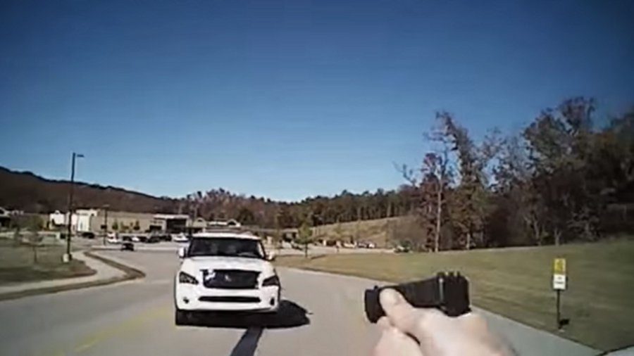 Sand Springs Police Officer Matt Stacy fired twice as a suspect aimed a stolen SUV directly at him last week.