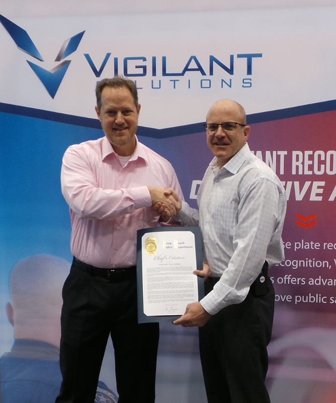 Vigilant Solutions' Shawn Smith receiving certificate from Long Beach Police Department's Deputy Chief David Hendricks.