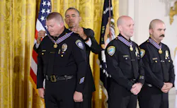 President Barack Obama awards Santa Monica Police Department Officers Jason Salas (R) and Robert Sparks and Captain Raymond Bottenfield (L) with the 2013-2014 Public Safety Office Medal of Valor during a ceremony in the East Room of the White House on May 16 in Washington, D.C. President Barack Obama awards Santa Monica Police Department Officers Jason Salas (R) and Robert Sparks and Captain Raymond Bottenfield (L) with the 2013-2014 Public Safety Office Medal of Valor during a ceremony in the East Room of the White House on May 16 in Washington, D.C.