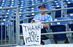 A fan shows his support for the police before a preseason game between the San Francisco 49ers and the San Diego Chargers on Sept. 1 at Qualcomm Stadium in San Diego. A fan shows his support for the police before a preseason game between the San Francisco 49ers and the San Diego Chargers on Sept. 1 at Qualcomm Stadium in San Diego.