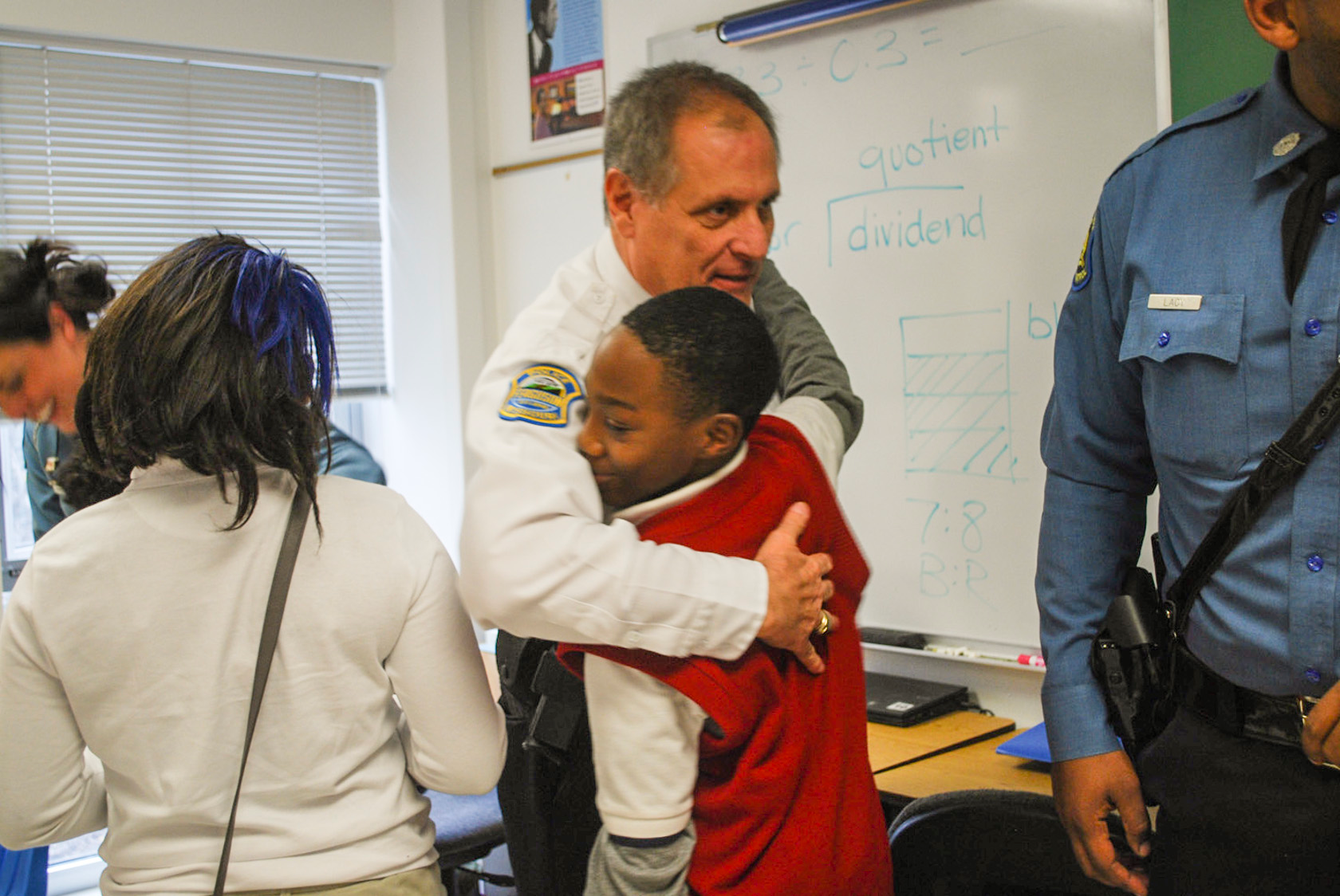 Lt. Eickhoff connects with students during a Secret Santa shop.