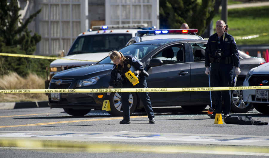 Police mark shell casings on Independence Avenue near the U.S. Capitol after a woman tried to ram a U.S. Capitol Police cruiser, resulting in an officer firing shots, on Wednesday morning, March 29, 2017. The incident took place on Independence Avenue SW in Washington, D.C. next to the Botanic Gardens and near the Rayburn House Office Building.