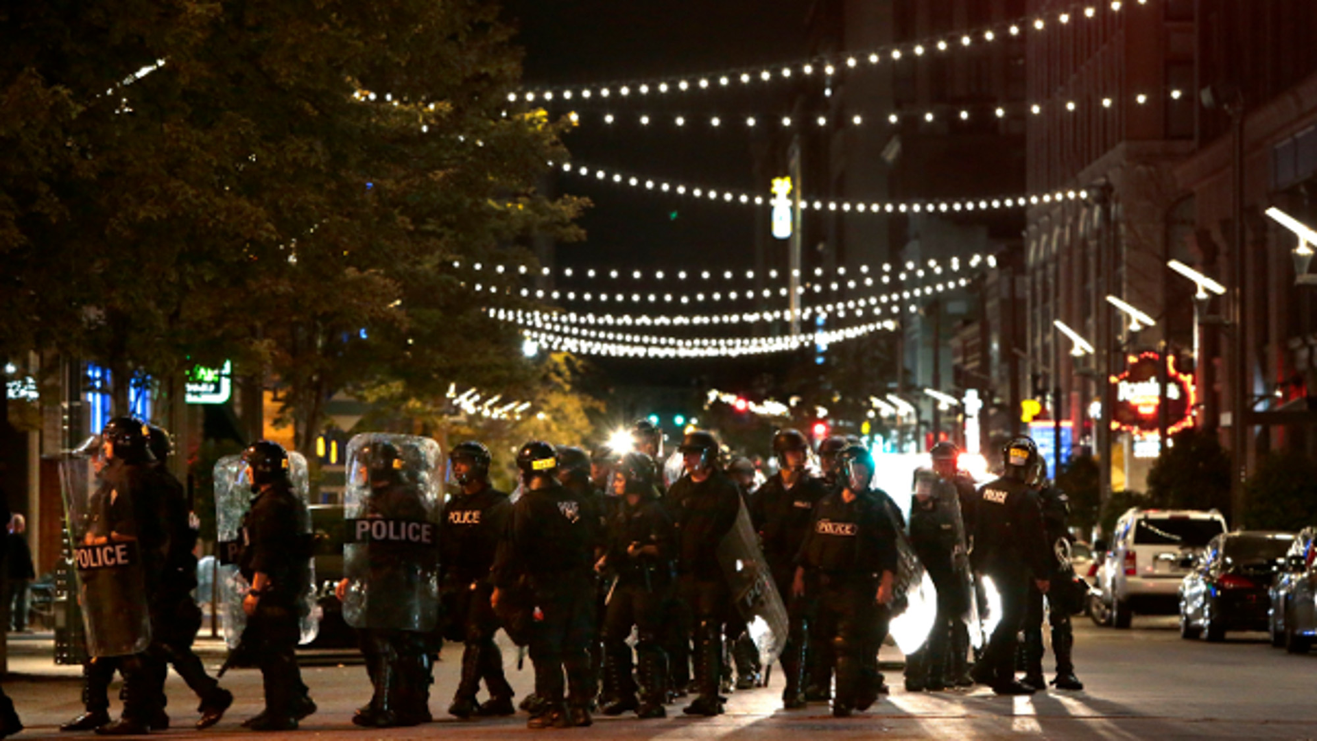 Police officers move on Washington Avenue at Tucker Boulevard as police clear the entertainment district on Sunday, Sept. 17, 2017.
