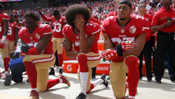 From left, San Francisco 49ers' Eli Harold (58), quarterback Colin Kaepernick (7) and Eric Reid (35) kneel during the national anthem before their NFL game against the Dallas Cowboys on Sunday, Oct. 2, 2016 in Santa Clara, Calif. From left, San Francisco 49ers' Eli Harold (58), quarterback Colin Kaepernick (7) and Eric Reid (35) kneel during the national anthem before their NFL game against the Dallas Cowboys on Sunday, Oct. 2, 2016 in Santa Clara, Calif.