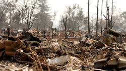 Christopher Osborne, 16, looks over the firestorm ruins in the Coffee Park neighborhood of Santa Rosa, Calif. on Wednesday, Oct. 18, 2017. Christopher Osborne, 16, looks over the firestorm ruins in the Coffee Park neighborhood of Santa Rosa, Calif. on Wednesday, Oct. 18, 2017.