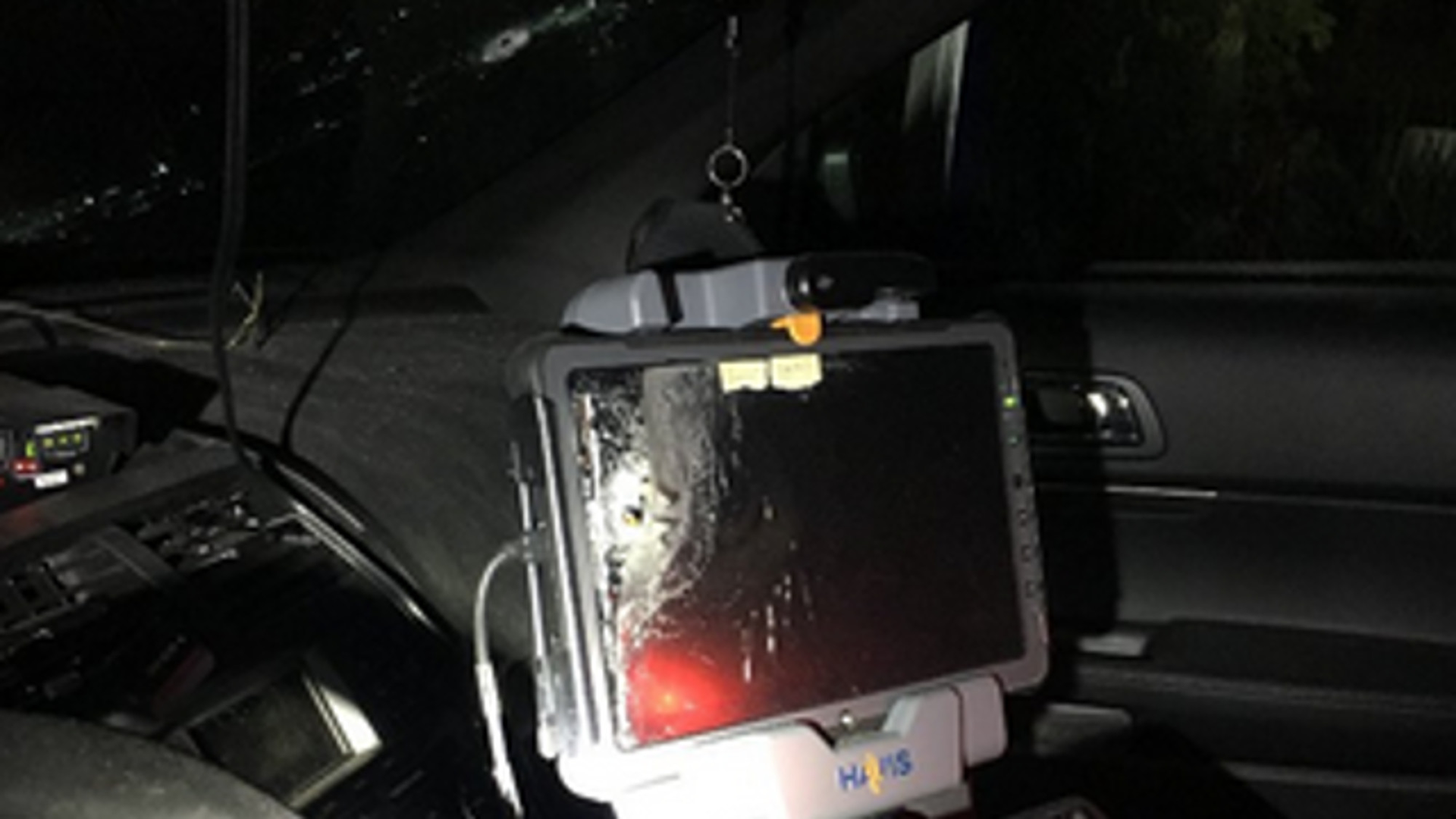 Multiple shots from the gunmen struck the trooper's patrol car, damaging the front end and windshield of the vehicle, as well as the in-car computer.