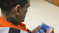 Anthony Woodman using a Securus Technologies SecureView® Tablet. Anthony Woodman using a Securus Technologies SecureView® Tablet.
