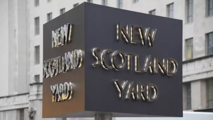 The officer with the Metropolitan Police Service in London was detaining a man at the Croydon Custody Centre in Windmill Lane early Friday morning when the shooting occurred.