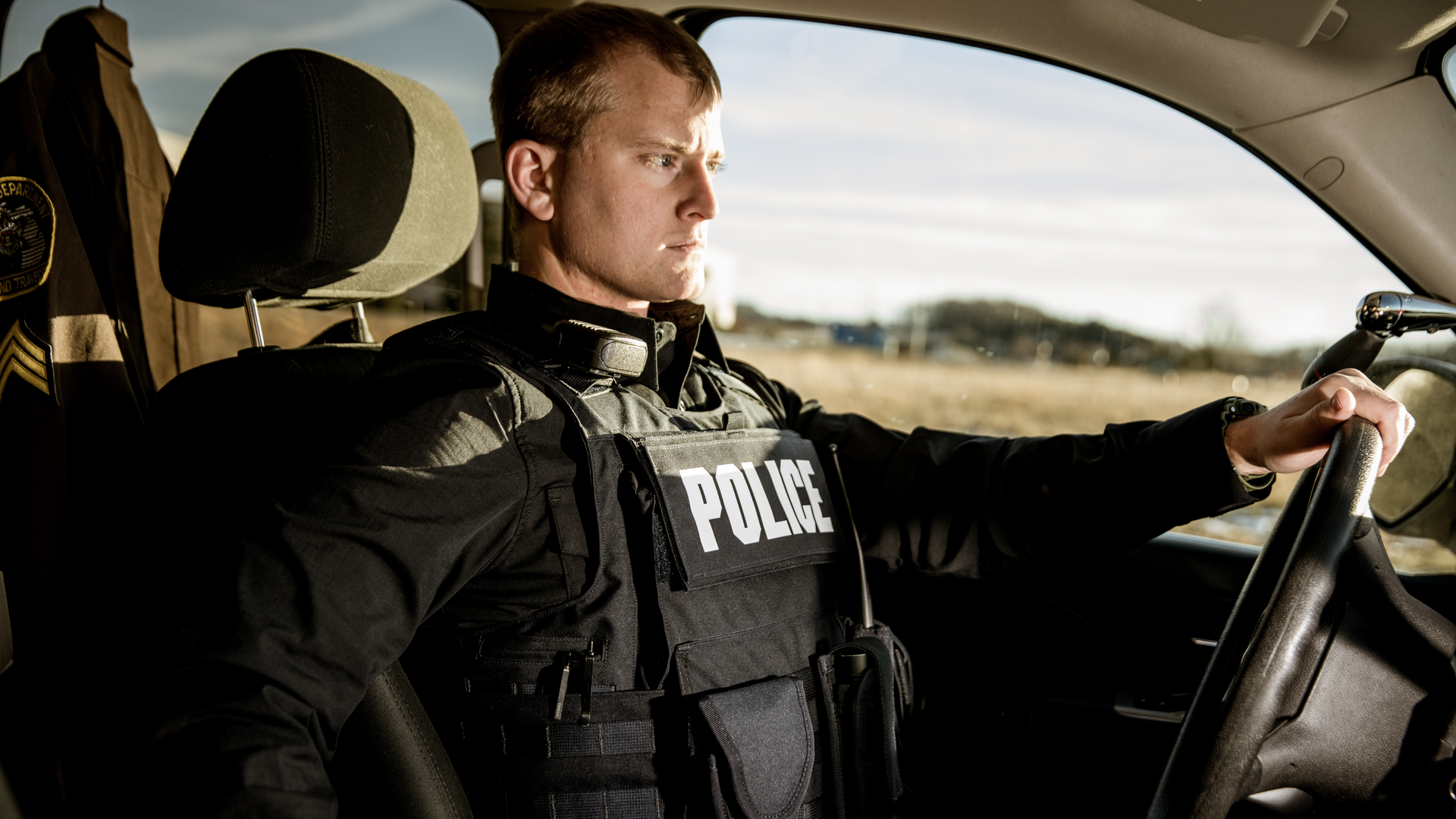 Properly fit body armor has to provide maximum coverage but also take into consideration the amount of time officers spend sitting in their patrol vehicle. Seen here is Hard Core PT overt/outer carrier from Armor Express.