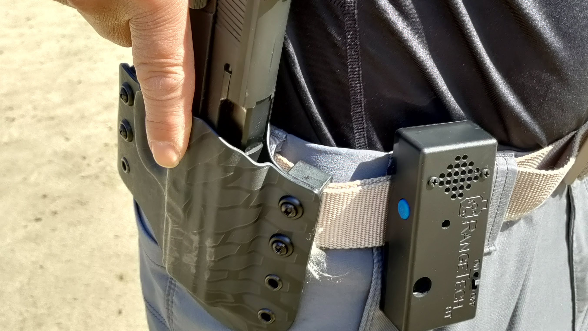 The RangeTech Shot Timer doesn't take up much space on the belt. It is controlled by an app on the user's smart phone. You're looking at Lindsey's new On Your 6 Designs holster for his FNP-9.