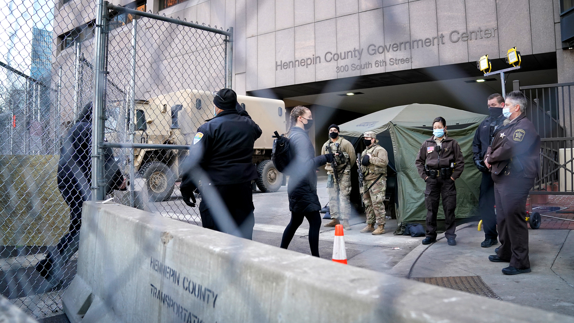 Pedestrians were cleared one at a time through one gate outside the Hennepin County Courthouse, site of the trial of former Minneapolis police officer Derek Chauvin in the death of George Floyd.