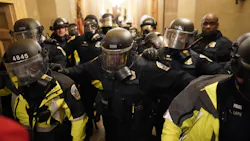 Riot police clear the hallway inside the Capitol on Jan. 6, 2021, in Washington, D.C. Riot police clear the hallway inside the Capitol on Jan. 6, 2021, in Washington, D.C.