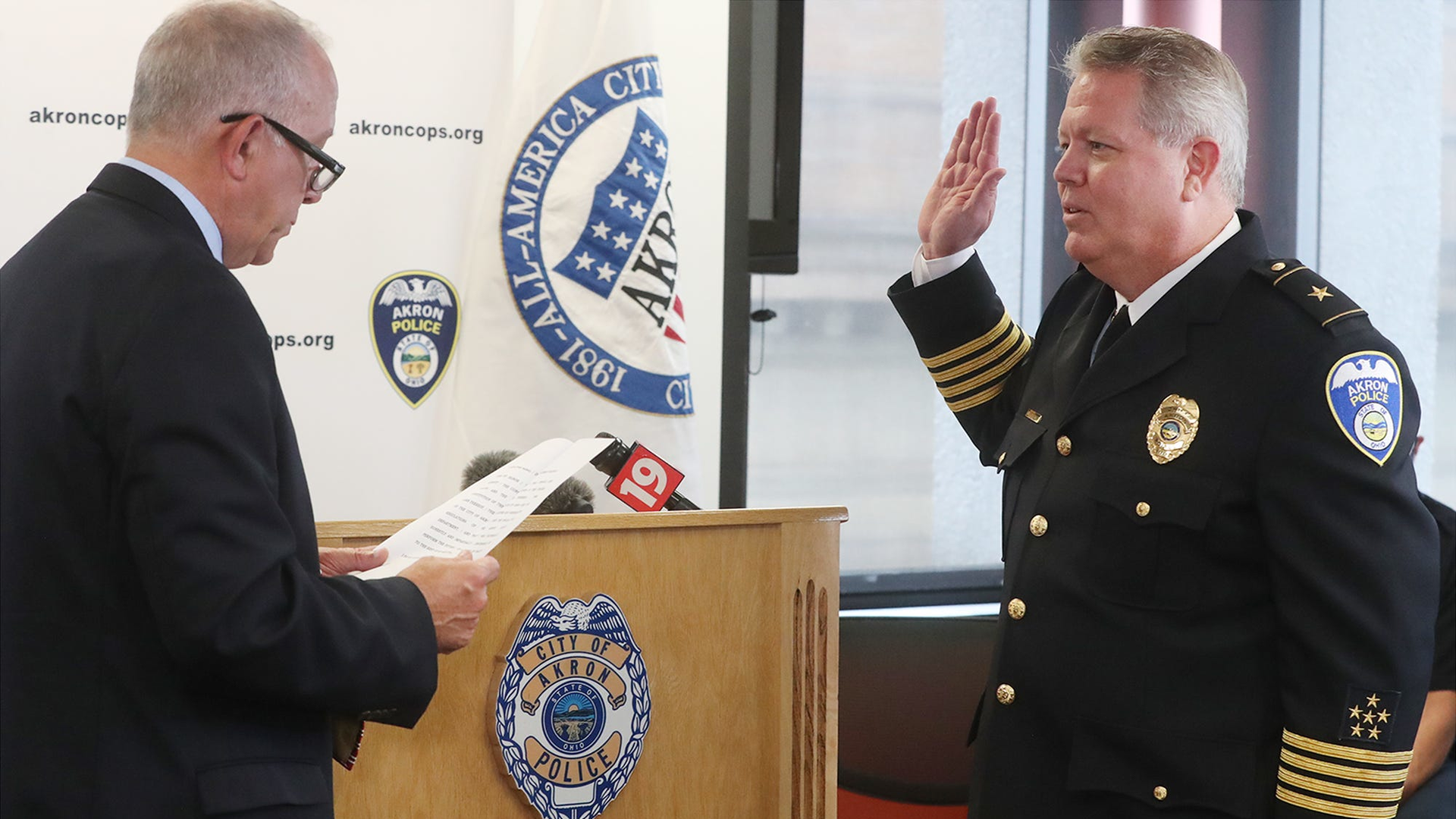 Akron, OH, Mayor Dan Horrigan administers the oath of office to Akron Police Chief Steve Mylett on Thursday during a swearing-in ceremony at the Harold Stubbs Safety Building in Akron.
