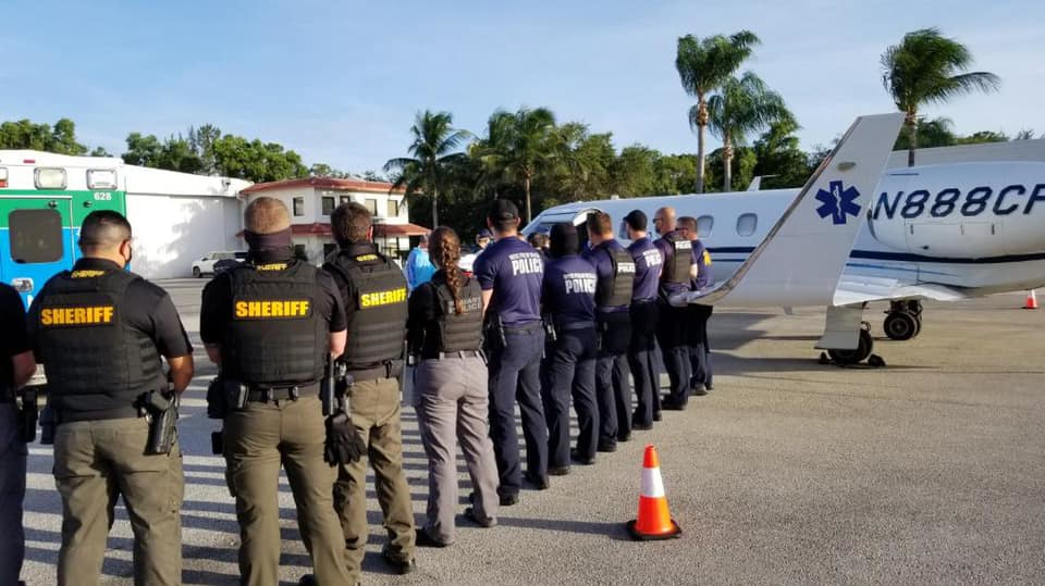 A West Palm Beach police officer who has been on a ventilator after contracting the virus is being flown to Ohio to undergo a procedure to take the workload off the heart and lungs.