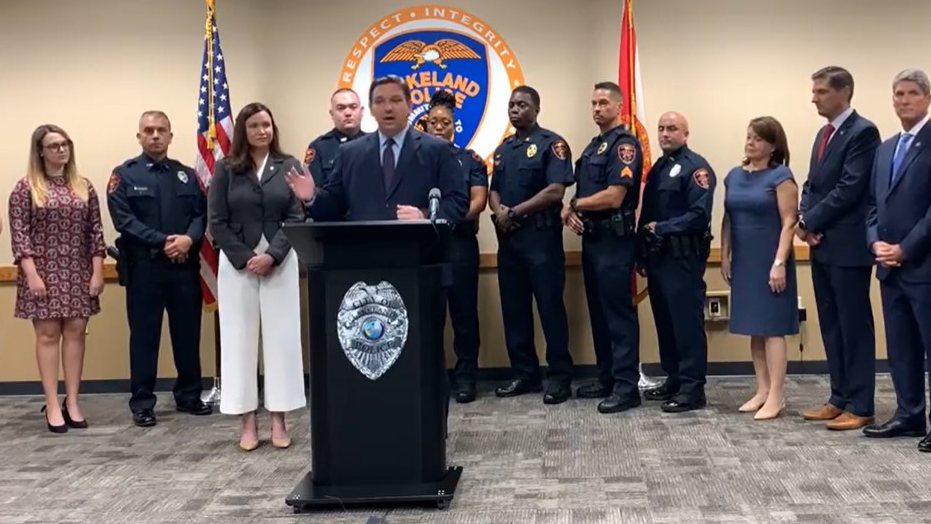 Florida Gov. Ron DeSantis proposes $5,000 signing bonuses during a news conference at the Lakeland Police Department on Tuesday.