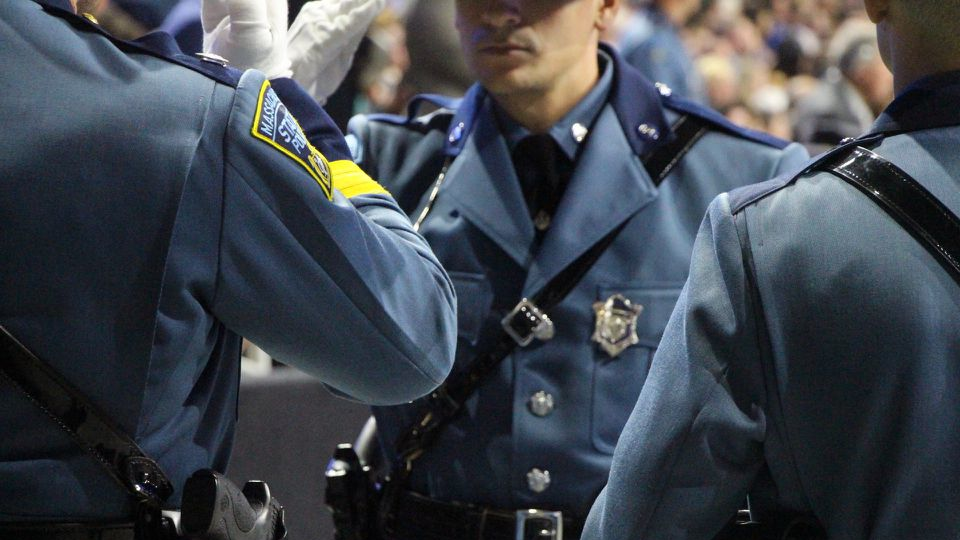 Massachusetts State Police troopers from the 84th Recruit Training Troop receive their badges during a pinning ceremony at the DCU Center in Worcester on Thursday, June 27, 2019.