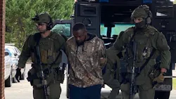 Members of Georgia's SWAT unit take Damien Anthony Ferguson into custody Sunday. Members of Georgia's SWAT unit take Damien Anthony Ferguson into custody Sunday.