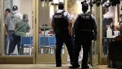 In this file photo, police officers arrive for a meeting at the Fraternal Order of Police Lodge 7 in Chicago on Wednesday. In this file photo, police officers arrive for a meeting at the Fraternal Order of Police Lodge 7 in Chicago on Wednesday.