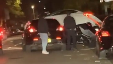 A man drive over an NYPD cruiser--using the hood as a ramp--to escape arrest Thursday.