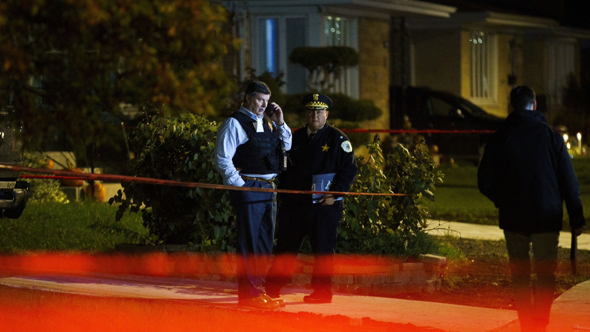 Police work at the scene where a 44-year-old off-duty Chicago police officer was fatally shot in the 8500 block of West Winona Street in the Oriole Park neighborhood on Tuesday.