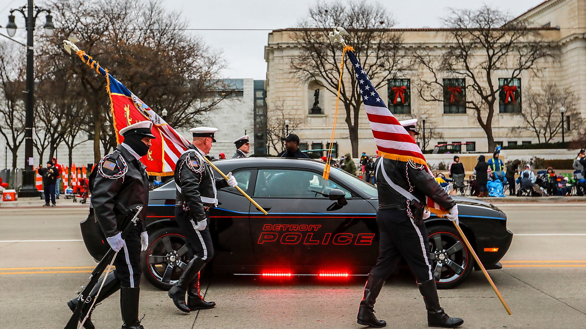 The Detroit Police Color Guard walks to the front to begin the 2018 America's Thanksgiving Parade in Detroit.
