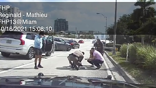 A Florida Highway Patrol trooper helps save a choking 1-year-old girl on the side of Interstate 95 in Miami in late October.